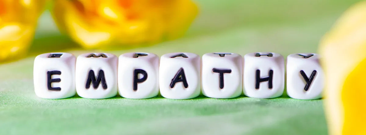 the word empathy spelled out on bracelet beads