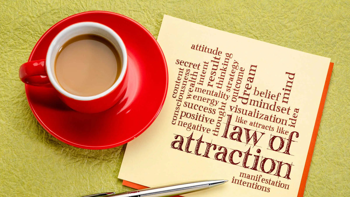 law of attraction napkin with coffee cup
