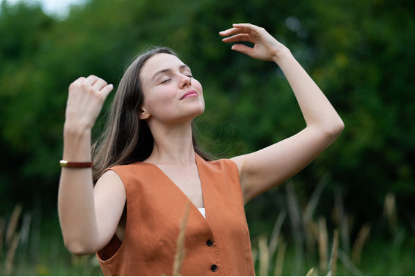 young woman self reflecting in nature