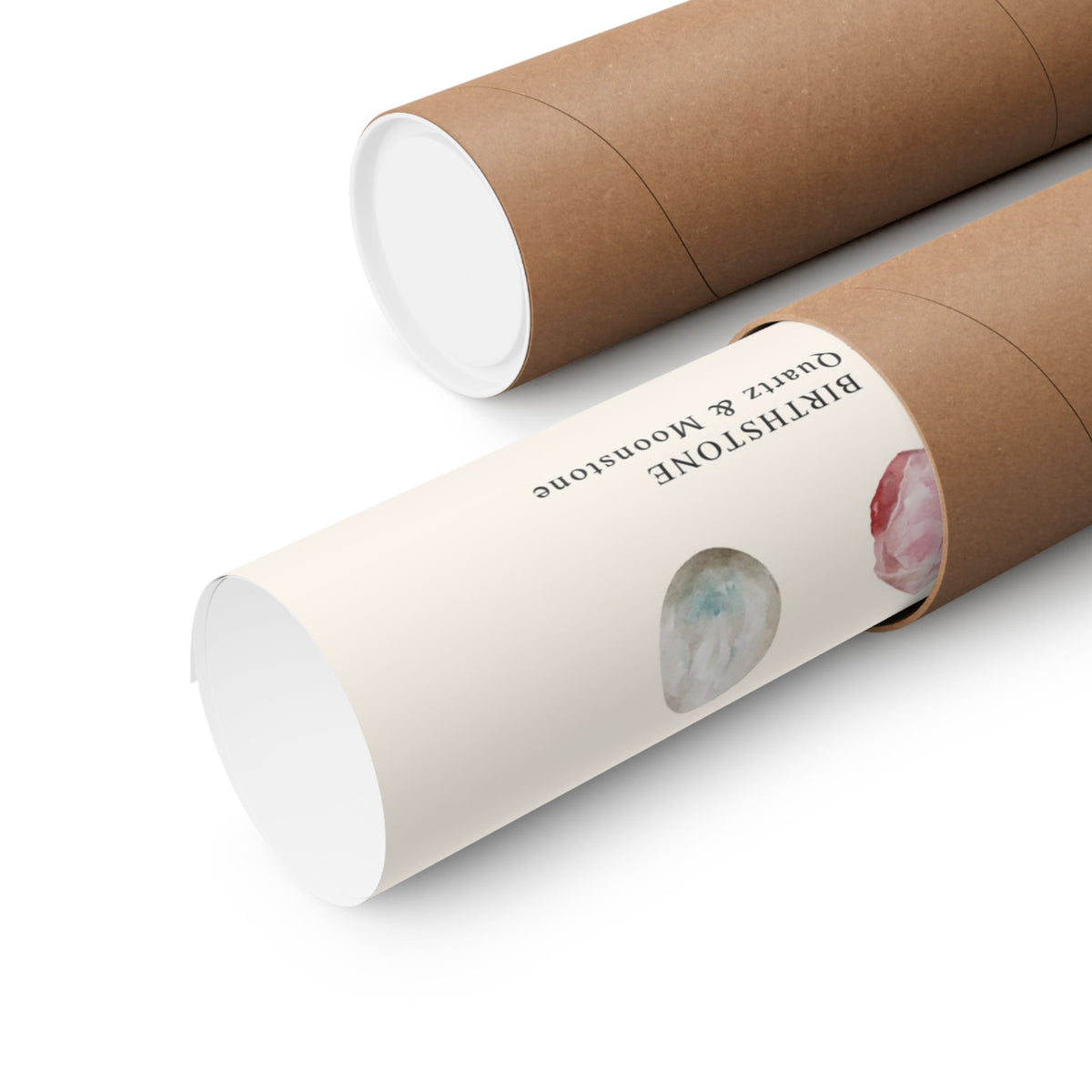 Two brown kraft paper display tubes on a white background, one open showing a white interior and the other closed with a cream paper sleeve printed with the text 'BIRTHSTONE Quartz & Moonstone' and crystal illustrations.