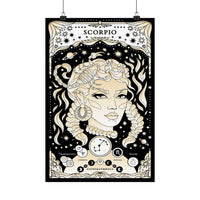 A vertical black-and-cream zodiac art print featuring Medusa and Scorpio imagery, hanging against a white wall with two visible clips at the top.