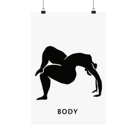 A minimalist black and white art print featuring a silhouette of a woman in a yoga pose with the word 'BODY' printed below in a sans-serif font. The poster is shown hanging from two black clips against a clean white background.