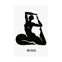A minimalist black graphic print featuring a silhouette of a woman in a yoga pose with the word 'MIND' printed below in a clean sans-serif font, set against a light gray rectangular card on a white background.