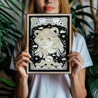 Aries cosmic zodiac portrait featuring a feminine figure with Ram horns surrounded by stars, Aries constellation, Mars symbol, and Fire element