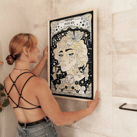woman holding frame Pisces cosmic zodiac portrait featuring a feminine figure surrounded by fish, stars, Pisces constellation, Neptune symbol, and Water element