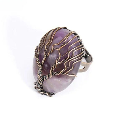 Amethyst gemstone ring with intricate wire-wrapped tree design, spiritual jewelry