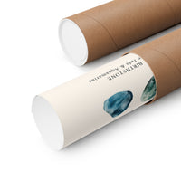 Two brown kraft paper mailing tubes on a white background, one labeled 'BIRCHSTONE Jade & Aquamarine' with watercolor illustrations of blue-green crystals.