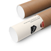 Two brown kraft paper display tubes on a white background, one partially opened to reveal a white interior and a printed label showing the text 'BIRCHSTONE Jasper & Black Obsidian' and a small crystal photo.