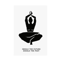 A minimalist black-and-white wall art print featuring a seated yoga figure with the text 'INHALE THE FUTURE EXHALE THE PAST' below, shown hanging against a white background.