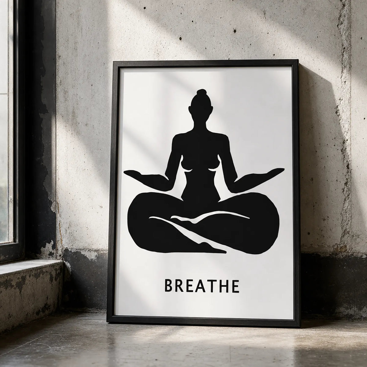 A minimalist black graphic print featuring a silhouette of a woman in a black frame