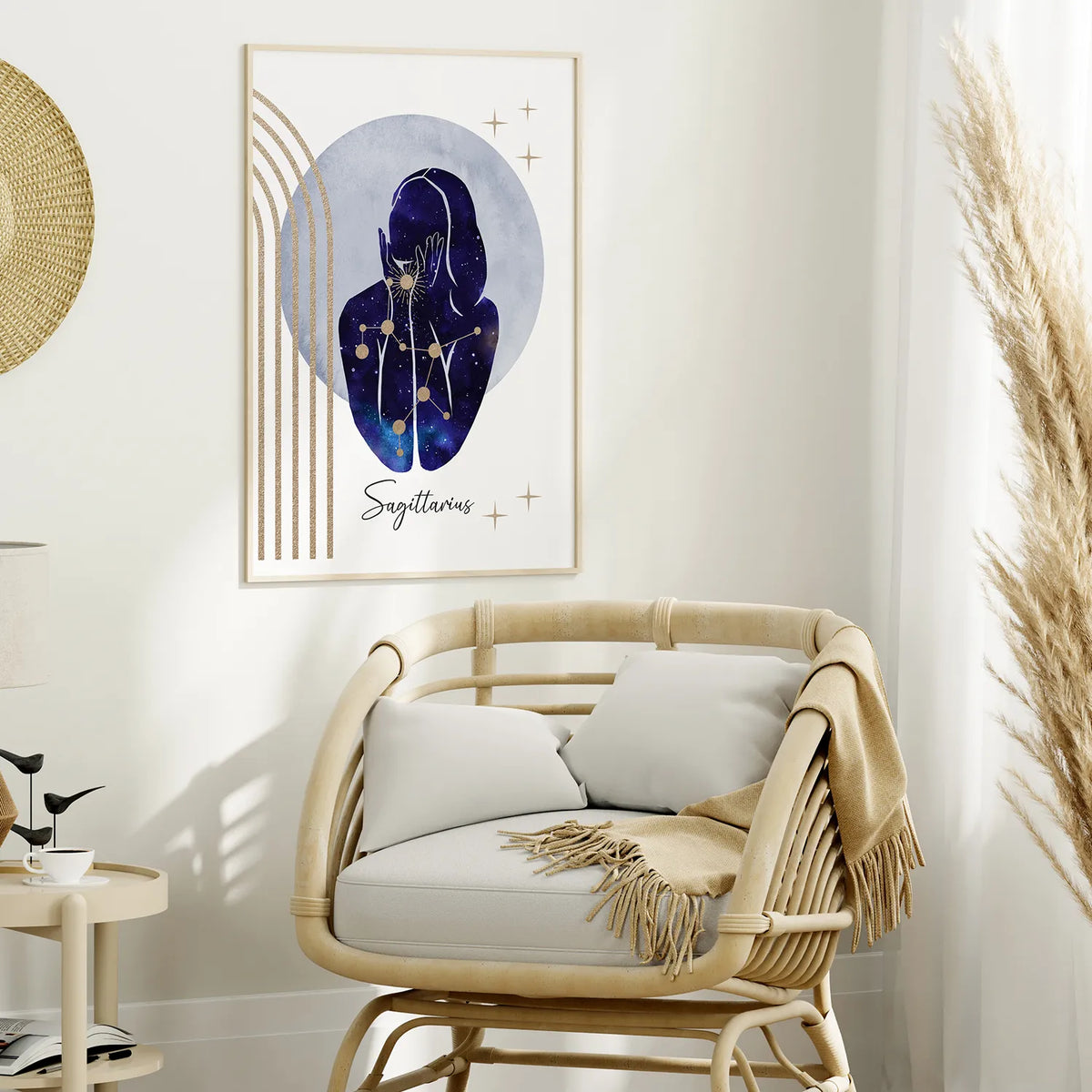 A framed art print featuring a stylized astrological portrait of Sagittarius in deep blue and purple tones, hanging on a light wall above a rattan armchair in a styled room.