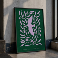 Modern dove botanical art print featuring a lavender dove surrounded by flowing leaves on a deep forest-green background, displayed in a black frame.
