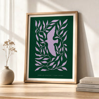 Modern dove botanical art print featuring a lavender dove surrounded by flowing leaves on a deep forest-green background, displayed in a brown frame