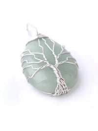 Green gemstone pendant with silver wire tree of life design, spiritual jewelry