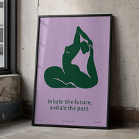 Framed minimalist yoga art print featuring a deep-green yoga silhouette and the words “Inhale the future, exhale the past” on a lavender background. w black frame
