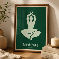 Minimalist meditation art print featuring a seated figure with raised arms in sage green against a forest-green background, displayed in a wooden frame.