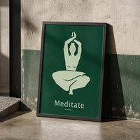 Minimalist meditation art print featuring a seated figure with raised arms in sage green against a forest-green background, displayed in a black frame.