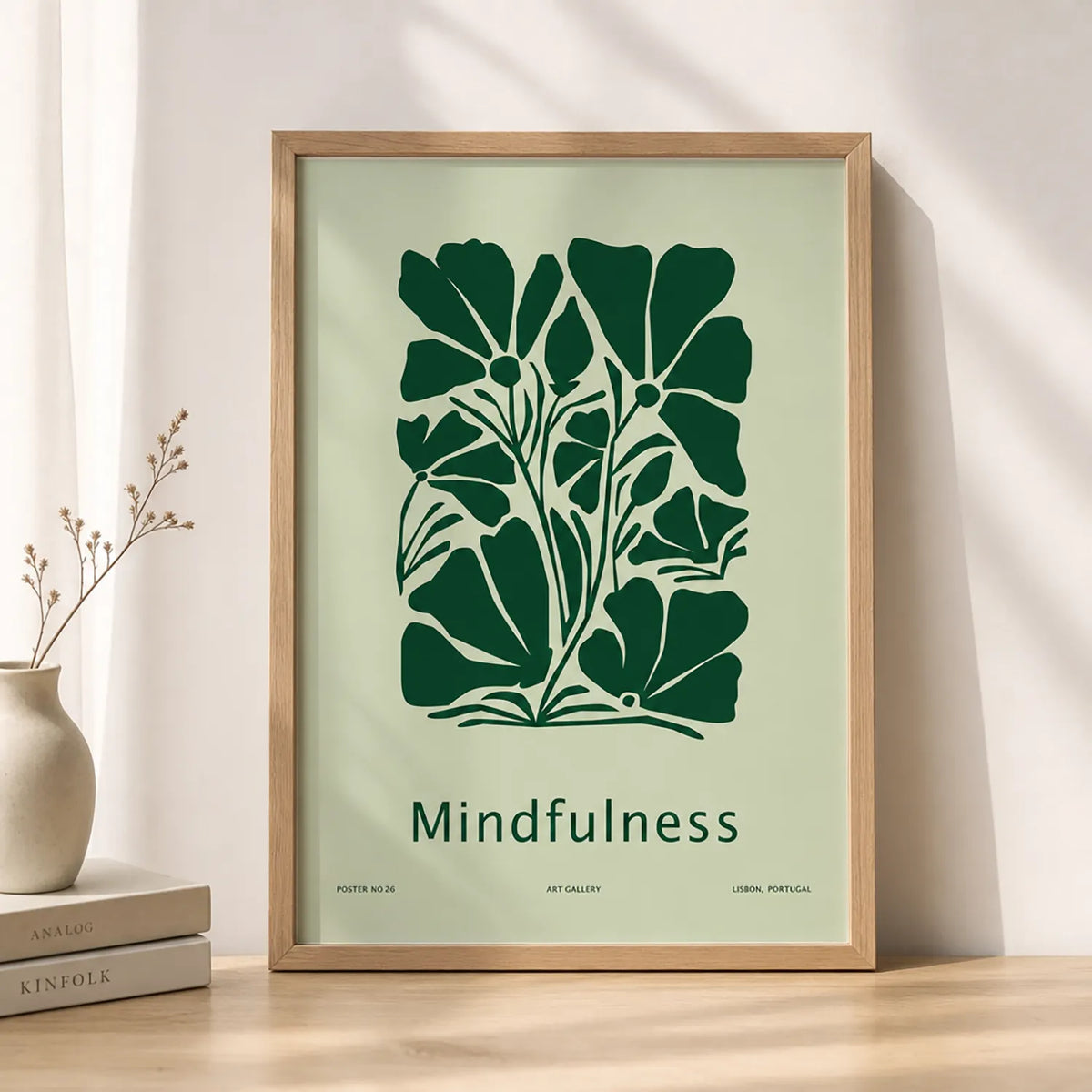 Minimalist mindfulness art print featuring bold dark-green botanical flowers and the word “Mindfulness” on a pale-green background, displayed in a brown frame.