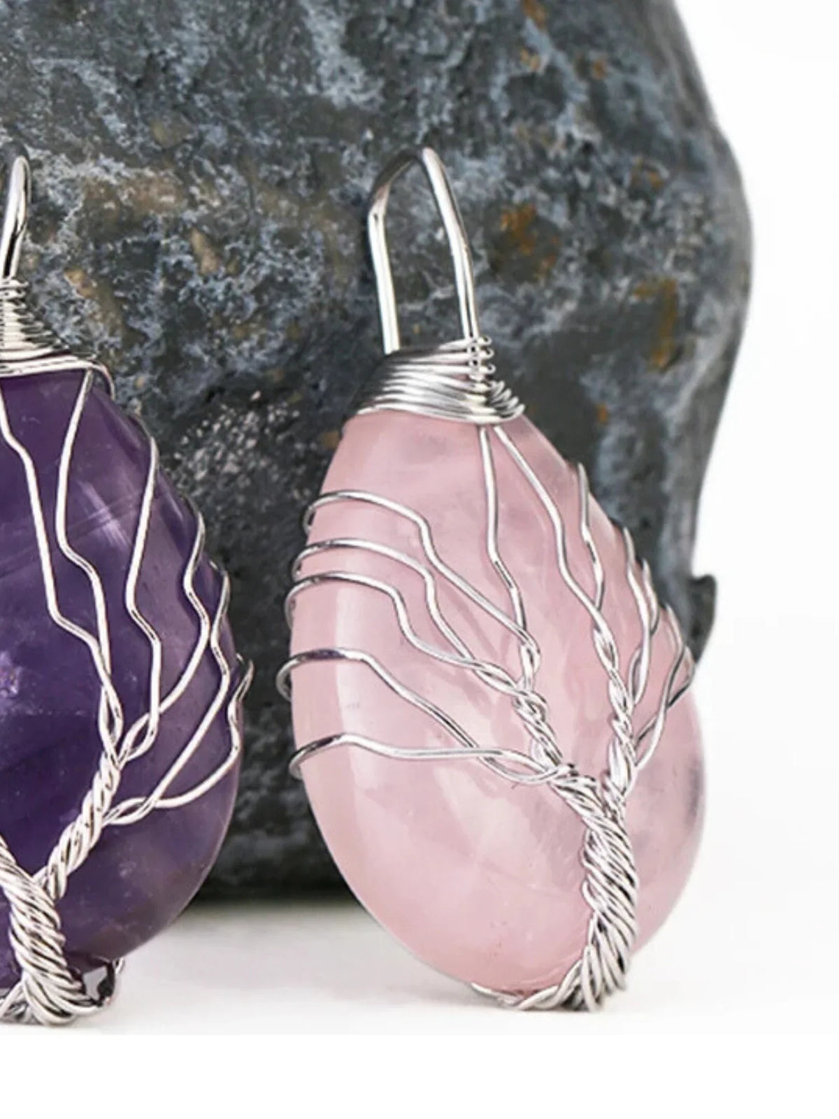 Purple amethyst and pink rose quartz crystal pendants with wire tree designs