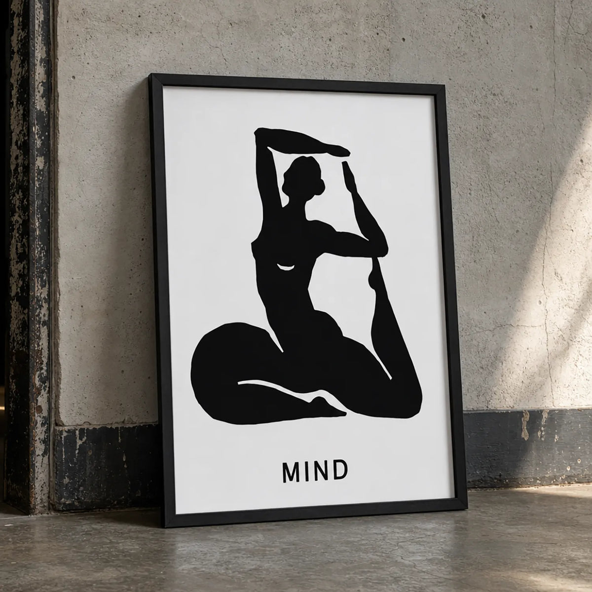 A minimalist art print featuring a black silhouette of a woman in a yoga pose on a white background, with the word 'MIND' in black frame